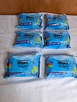 Six sealed packs arranged on surface