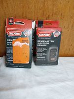 Front view of both Genie remote boxes, showing branding and damaged packaging