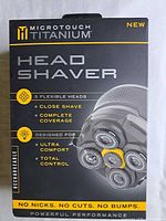 Front of MicroTouch Titanium Head Shaver retail box showing product name and image of five-head shaver