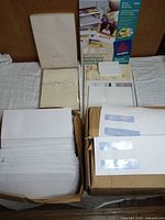 All items overview: Hallmark stationery box, Avery pack, stack of envelopes, window envelopes