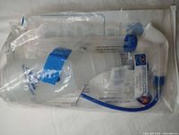 Sealed plastic bag containing ear washer bottle, tubing and parts