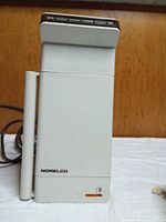 Front view of Norelco TS-60 steamer showing logo and power indicator