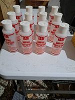 Group of rust remover bottles on table