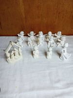 Group view of all figurines arranged on surface