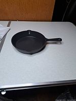 Oblique view of skillet showing overall form and handles