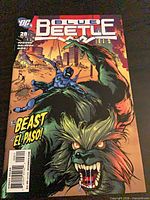 Front cover showing issue 28 of Blue Beetle, standard cover, publisher and artwork visible