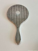 Full view of sterling silver hand mirror front