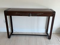 Front view of mahogany desk showing overall form