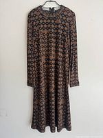 Full front view of dress on hanger