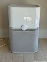 Front view of Blueair Blue Pure 211+ purifier showing overall form and control button