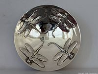 Front view showing four dragonfly motifs