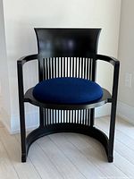 Front angled view of Cassina 606 barrel chair