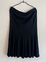 Full view of black Jean Muir skirt on hanger