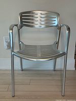 Front view showing seat, backrest slats, and arms