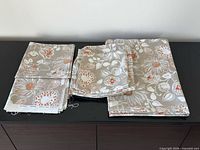 Assorted fabric pieces laid out, showing table runners, pillow shams and fabric