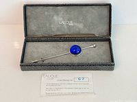 Open Lalique box with stick pin and control card