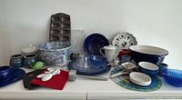 Group shot of entire blue and white kitchenware lot on countertop