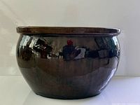 Front view of brown glazed ceramic jardiniere