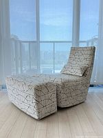 Chair with ottoman and pillow in full view