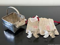 Overview showing basket, two napkin rings, and pouches