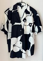 Full view of front of shirt on hanger