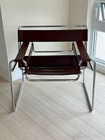 Front view of Wassily chair showing chrome frame and Bordeaux leather