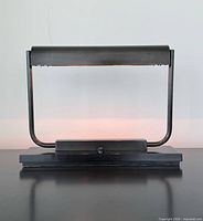 front view of bronze desk lamp powered off