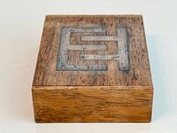 Top view of rosewood box showing sterling silver inlay and wood grain