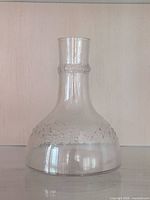 Full front view of clear glass decanter