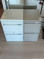 Front view showing both two-drawer cabinets side by side