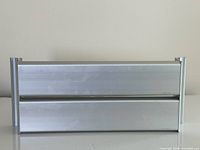 Front view of aluminum dual roll dispenser