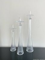 All three fluted glass candle holders displayed