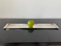 Full view of tray with apple for scale