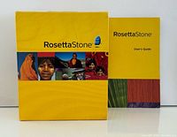 Front of Rosetta Stone French boxed set with user guide beside it