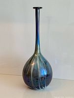 Full view of tall iridescent glass vase