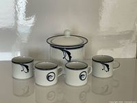 full set: sugar bowl with lid and four matching cups