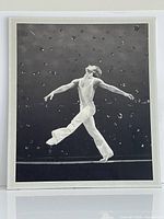 Front view of mounted black and white photographic print showing Baryshnikov mid-leap