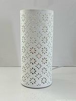 Full view of cylindrical white porcelain lamp