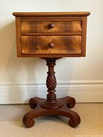 Front view showing drawers, pedestal, base