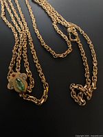 Full length of gold-filled slide chain with clasp and slide visible