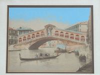 Close view of coloured photograph showing Rialto Bridge and gondola