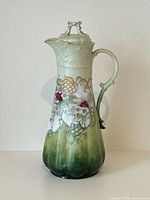 Full front view of cocoa pot with lid