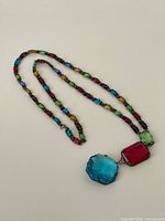Necklace laid out showing full length and pendant stones