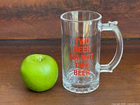 Mug beside apple showing full view and scale