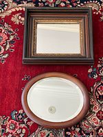 Rectangular and oval mirrors on rug showing overall appearance