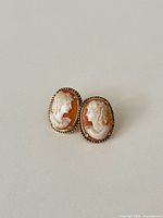 Both oval cameo earrings front view