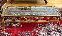 Full view of bamboo and rattan coffee table on red rug