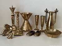 Group shot of all eleven brass items