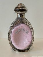 Front view of Haig's Dimple decanter showing silver overlay and clear glass