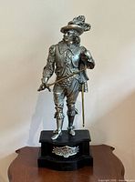 Full view of Don Juan spelter sculpture on black iron base